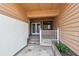 Charming front porch view with tiled flooring and a cozy entrance to the home at 2421 Lake Point Ln, Clearwater, FL 33762