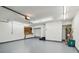 Spacious two-car garage with painted floor and room for storage at 2421 Lake Point Ln, Clearwater, FL 33762