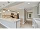 Bright kitchen features a large island, stainless steel appliances, and white cabinetry at 2421 Lake Point Ln, Clearwater, FL 33762