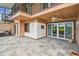 The ground level patio features tile flooring, ceiling fan, and sliding glass doors for indoor/outdoor living at 2421 Lake Point Ln, Clearwater, FL 33762