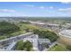 Scenic aerial view of a condo complex surrounded by lush greenery, a golf course, and residential areas at 2469 Franciscan Dr # 59, Clearwater, FL 33763