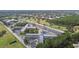 Extensive aerial view shows the beautiful, well-maintained, multi-building complex with generous parking at 2469 Franciscan Dr # 59, Clearwater, FL 33763