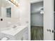 Bathroom showing vanity and view into the bedroom at 2469 Franciscan Dr # 59, Clearwater, FL 33763