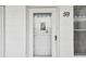 Close-up of the entrance door to unit 59, providing a welcoming first impression at 2469 Franciscan Dr # 59, Clearwater, FL 33763