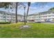 Well-maintained community complex with mature trees and ample parking in a serene environment at 2469 Franciscan Dr # 59, Clearwater, FL 33763