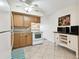 Bright kitchen features tile flooring, cabinets, and modern appliances for comfortable cooking at 2469 Franciscan Dr # 59, Clearwater, FL 33763