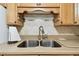 Kitchen featuring a stainless steel sink and neutral countertops at 2469 Franciscan Dr # 59, Clearwater, FL 33763