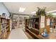 Cozy library space with abundant bookshelves, providing a quiet area for reading and relaxation for the community at 2469 Franciscan Dr # 59, Clearwater, FL 33763