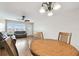 Open concept living and dining area with wood flooring and ceiling fan at 2469 Franciscan Dr # 59, Clearwater, FL 33763