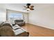 Bright living room features a large window and wood flooring at 2469 Franciscan Dr # 59, Clearwater, FL 33763