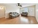 Comfortable living room features a large window and wood flooring at 2469 Franciscan Dr # 59, Clearwater, FL 33763