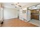 Open-concept living room and kitchen with wood floors and white walls at 2469 Franciscan Dr # 59, Clearwater, FL 33763