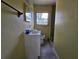 Small bathroom featuring a vanity, mirror, window and toilet at 2510 Queen S St, St Petersburg, FL 33712