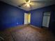Modest bedroom with carpet flooring, ceiling fan, and closet at 2510 Queen S St, St Petersburg, FL 33712