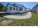 Cozy single-story home with sidewalk, and some grass at 2510 Queen S St, St Petersburg, FL 33712