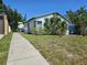 Charming single-story home with a walkway and front yard at 2510 Queen S St, St Petersburg, FL 33712