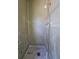 Shower stall with tiled walls, shower head and drain at 2510 Queen S St, St Petersburg, FL 33712