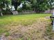 Wide shot of a large backyard surrounded by a weathered wooden fence at 2701 47Th N Ave, St Petersburg, FL 33714