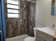 Modern bathroom showcasing tiled walls, a walk-in shower, and a contemporary vanity at 2701 47Th N Ave, St Petersburg, FL 33714