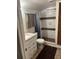 Bathroom with updated vanity and tiled walk-in shower with glass door at 2701 47Th N Ave, St Petersburg, FL 33714