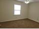 Cozy bedroom featuring neutral paint, carpet, window with natural light, and ceiling fan at 2701 47Th N Ave, St Petersburg, FL 33714