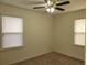 Inviting bedroom offers plush carpeting and dual windows ensuring plenty of natural light at 2701 47Th N Ave, St Petersburg, FL 33714