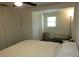 Bedroom offering neutral walls, carpet, and closet with shelving and storage space at 2701 47Th N Ave, St Petersburg, FL 33714