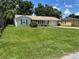 Charming single-story home with well-maintained lawn, attached garage, and mature landscaping creates a welcoming curb appeal at 2701 47Th N Ave, St Petersburg, FL 33714