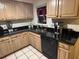 The kitchen offers wooden cabinets, granite countertops, and tile flooring at 2701 47Th N Ave, St Petersburg, FL 33714