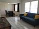 Open concept living room with tile floors, dining area, and large windows at 2701 47Th N Ave, St Petersburg, FL 33714