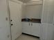 The mud room provides storage space for shoes and outerwear with a door for backyard access at 2701 47Th N Ave, St Petersburg, FL 33714