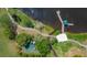 Aerial view of serene lake featuring a gazebo, walking paths and a community playground at 2811 Barret Ave, Plant City, FL 33566