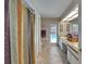 Bright bathroom with vanity, tile floors, and sliding glass door to the backyard pool area at 2811 Barret Ave, Plant City, FL 33566