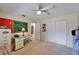 Bedroom featuring a ceiling fan, desk, chalkboard, and a large closet at 2811 Barret Ave, Plant City, FL 33566