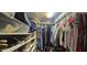 A well-organized walk-in closet with shelving for shoes and storage, and hanging racks for clothes at 2811 Barret Ave, Plant City, FL 33566