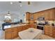Bright kitchen with granite countertops, stainless steel appliances, and an open view to the living room area at 2811 Barret Ave, Plant City, FL 33566