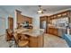 Open-concept kitchen featuring granite countertops, stainless steel appliances, and a breakfast bar with seating at 2811 Barret Ave, Plant City, FL 33566