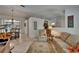 Cozy living room with tile floors, a comfortable sofa, and an adjacent dining area with a chandelier at 2811 Barret Ave, Plant City, FL 33566