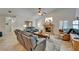 Cozy living room with a stone fireplace, neutral walls, tile floor and comfortable seating at 2811 Barret Ave, Plant City, FL 33566