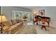 Cozy living room with a bay window, piano, and comfortable seating at 2811 Barret Ave, Plant City, FL 33566