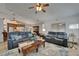 Living area with hardwood floors, ceiling fan, comfortable sofas and dining/kitchen area at 2811 Barret Ave, Plant City, FL 33566