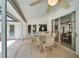 Spacious covered patio with a table, chairs, ceiling fan, and sliding glass doors at 2811 Barret Ave, Plant City, FL 33566