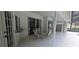 Enclosed patio with a dining set, ceiling fan, sliding glass doors, and windows at 2811 Barret Ave, Plant City, FL 33566