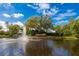 The community pond with fountain at the Walden Lake entrance creates a serene environment at 2811 Barret Ave, Plant City, FL 33566