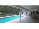 Screened in ground pool featuring an adjacent patio area and views of the house and yard at 2811 Barret Ave, Plant City, FL 33566