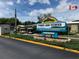Timber Lake Estates deed restricted condominium sign with landscaping and golf carts at 3041 Short Leaf St, Wesley Chapel, FL 33543