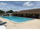 Community pool with ample seating and a clear blue swimming area at 3041 Short Leaf St, Wesley Chapel, FL 33543