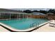 Community pool with seating and a covered area for shade at 3041 Short Leaf St, Wesley Chapel, FL 33543