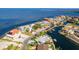 Panoramic aerial view of coastal waterfront homes along canals, offering direct access to the open water and scenic beauty at 3181 Gulf Winds Cir, Hernando Beach, FL 34607