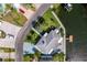 Aerial view of home with lush landscaping, boat dock, and inviting backyard in a tranquil waterfront neighborhood at 3181 Gulf Winds Cir, Hernando Beach, FL 34607